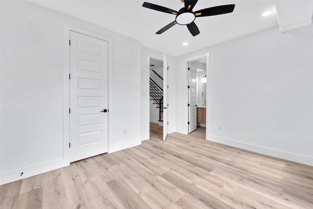 unfurnished bedroom with baseboards, recessed lighting, and light wood finished floors