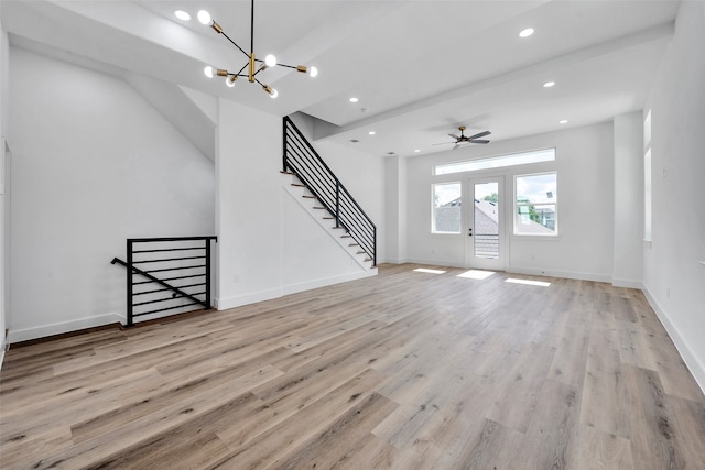 unfurnished living room featuring recessed lighting, baseboards, and light wood-type flooring