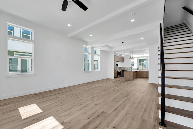 unfurnished living room with recessed lighting, light wood-style flooring, stairs, and ceiling fan