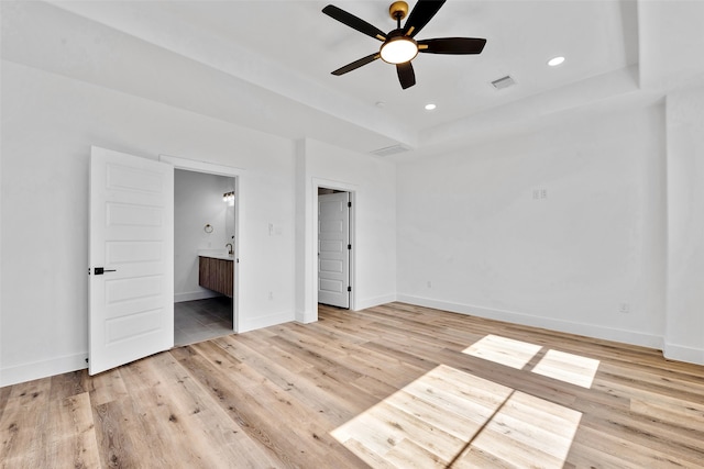 unfurnished bedroom with visible vents, light wood-style floors, baseboards, recessed lighting, and connected bathroom