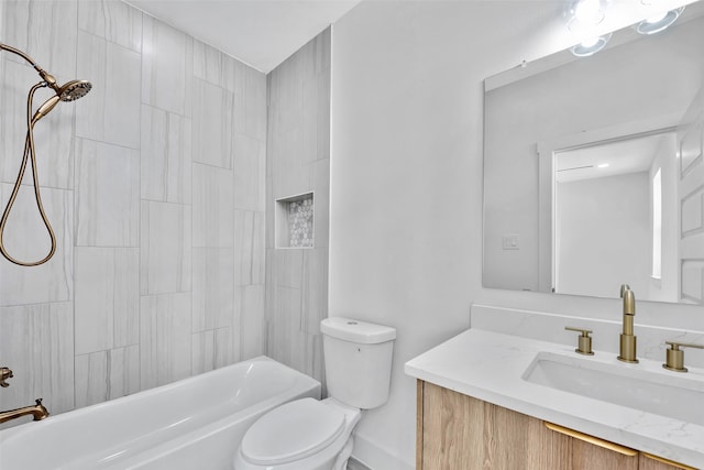full bath with vanity, baseboards, bathtub / shower combination, and toilet