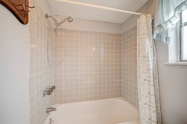 bathroom with shower / bath combination with curtain