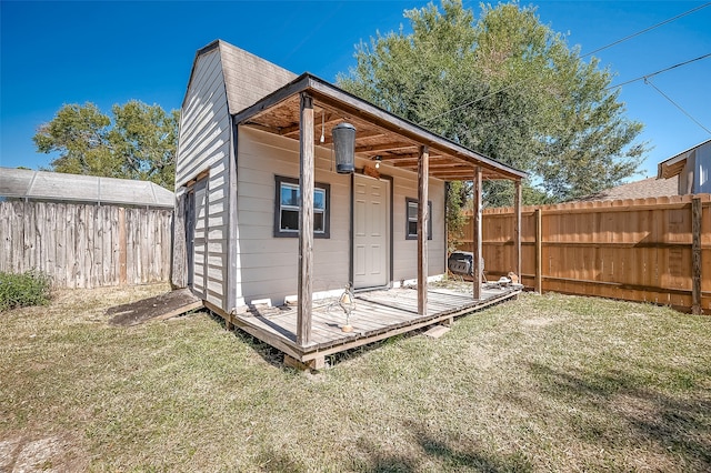 view of outbuilding with a yard