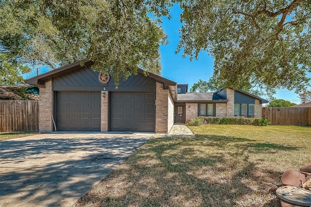 single story home featuring a front yard and a garage