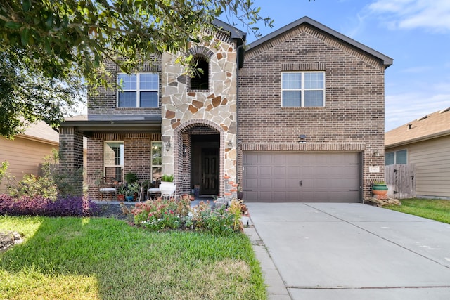 view of front of house featuring a front lawn and a garage