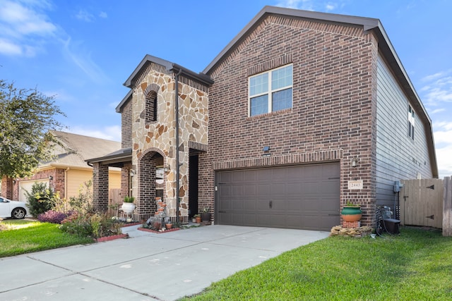 view of front of house featuring a front yard and a garage