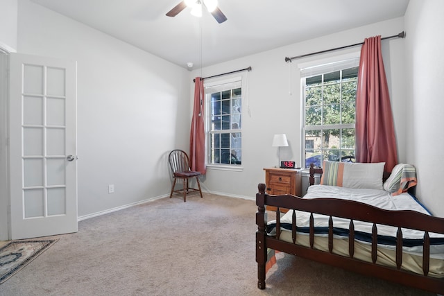 carpeted bedroom featuring ceiling fan and vaulted ceiling