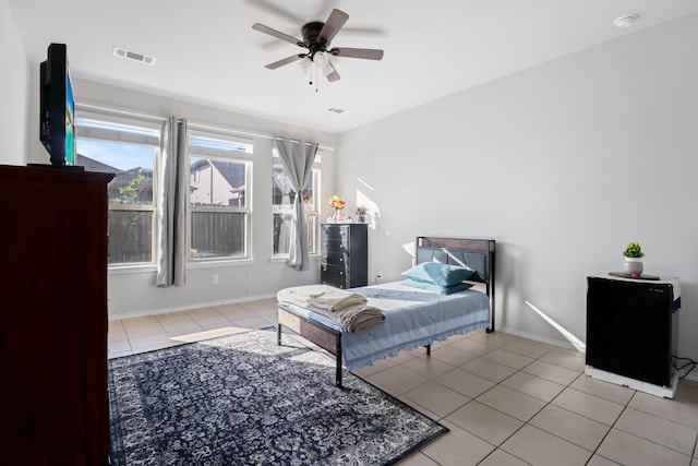 bedroom with light tile patterned floors and ceiling fan