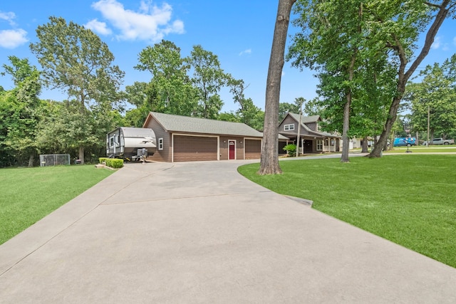 view of front of house featuring a front yard and a garage