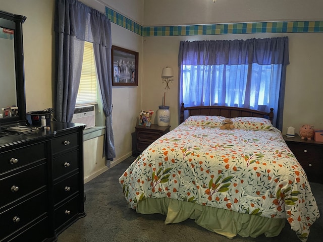 bedroom featuring dark colored carpet