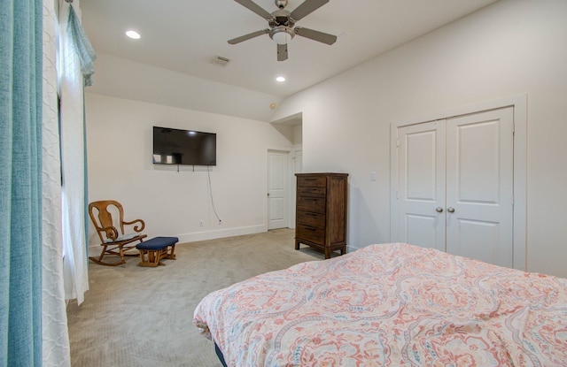 carpeted bedroom featuring a closet and ceiling fan