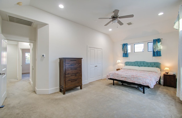 bedroom with ceiling fan, lofted ceiling, and multiple windows