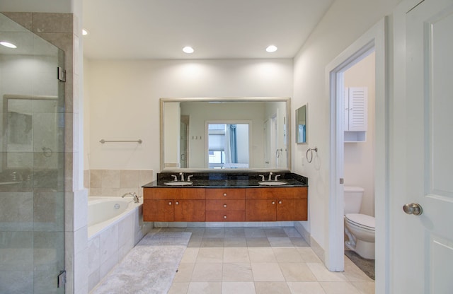 full bathroom featuring toilet, shower with separate bathtub, vanity, and tile patterned floors