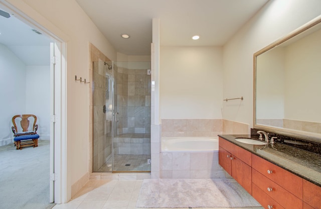 bathroom featuring vanity, separate shower and tub, and tile patterned flooring