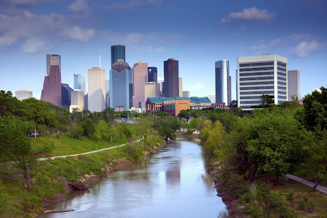 property's view of city featuring a water view