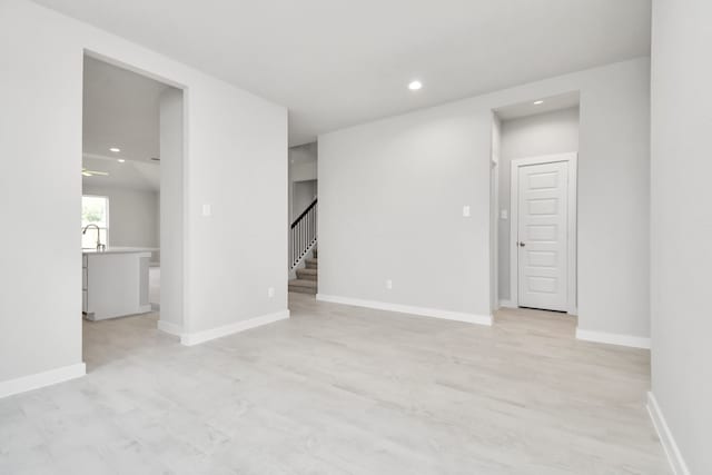 spare room with light wood-type flooring