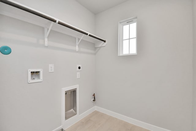 washroom with gas dryer hookup, hookup for an electric dryer, hookup for a washing machine, and light wood-type flooring