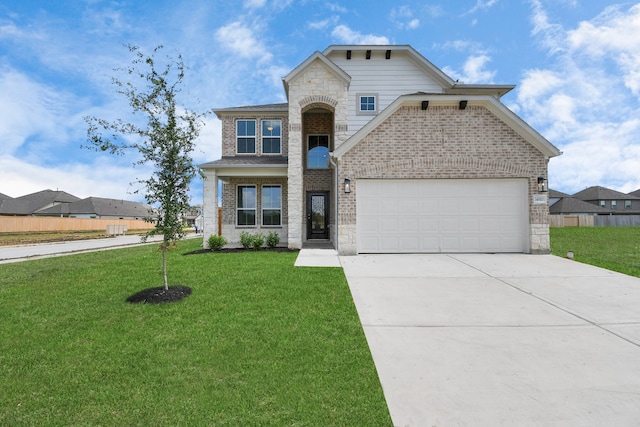 view of front of house featuring a front yard and a garage