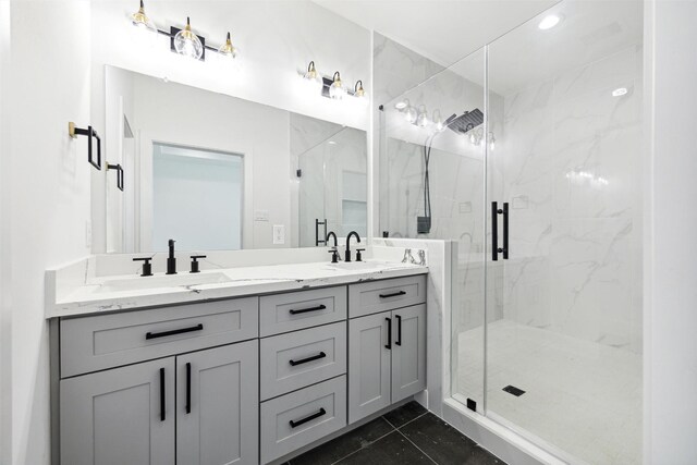 bathroom with tile patterned flooring, vanity, and walk in shower