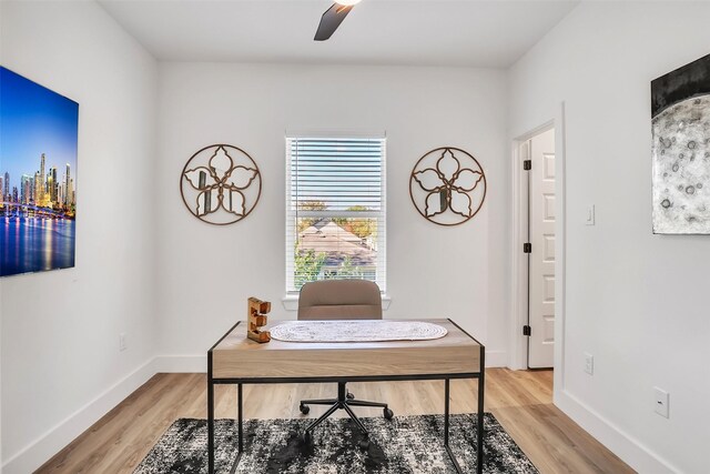 office with hardwood / wood-style flooring and ceiling fan