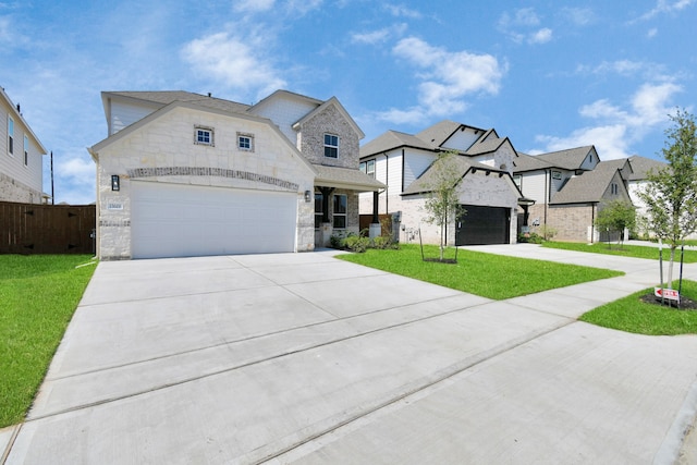 view of front of property with a front yard and a garage