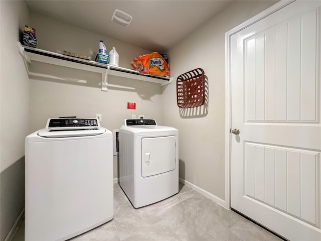 washroom featuring independent washer and dryer