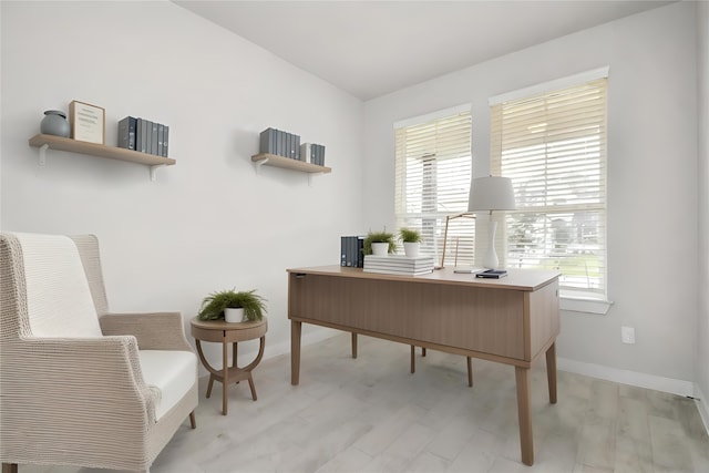 office area featuring light wood-type flooring and a wealth of natural light