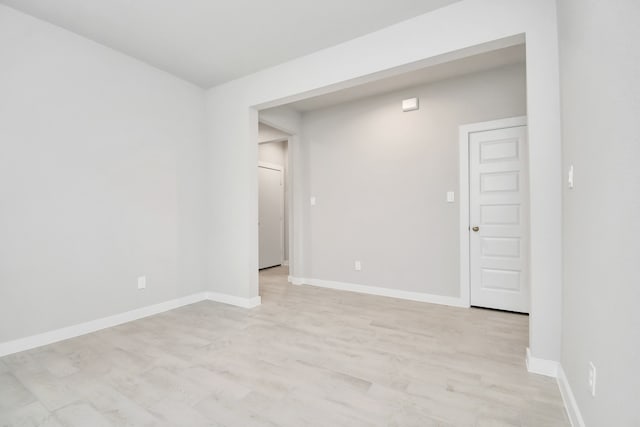 empty room with light hardwood / wood-style floors