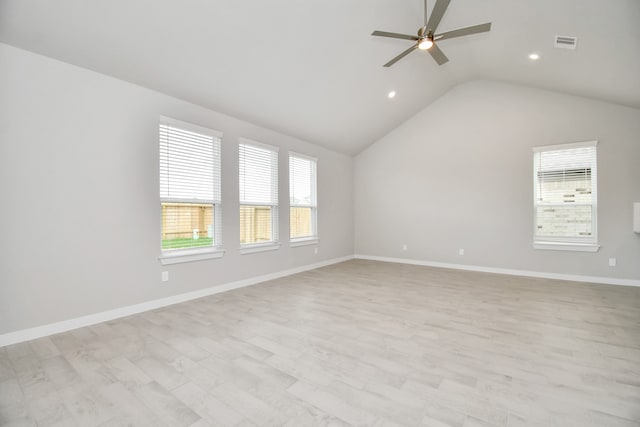 unfurnished room with ceiling fan, lofted ceiling, and light hardwood / wood-style floors