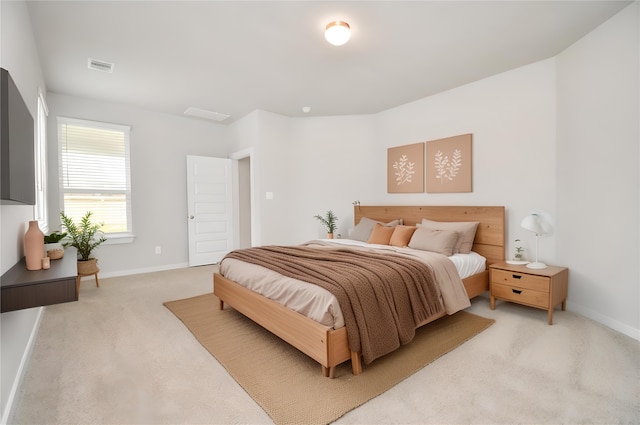 bedroom featuring light carpet