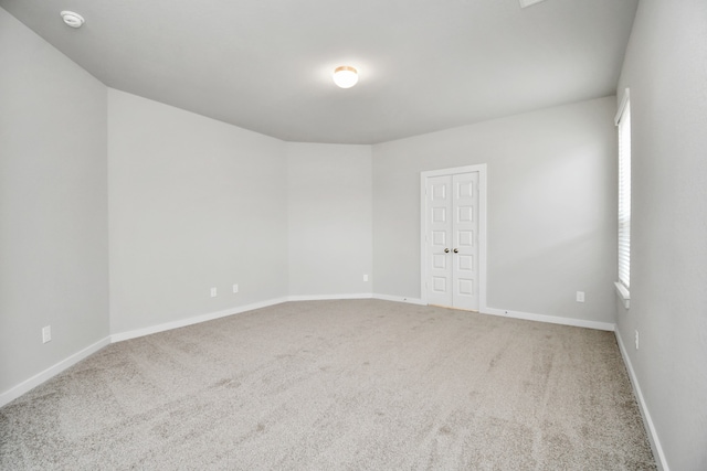 unfurnished room with carpet floors