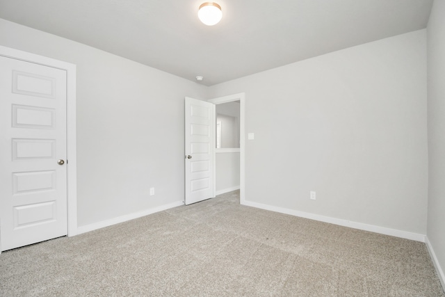 spare room featuring carpet flooring