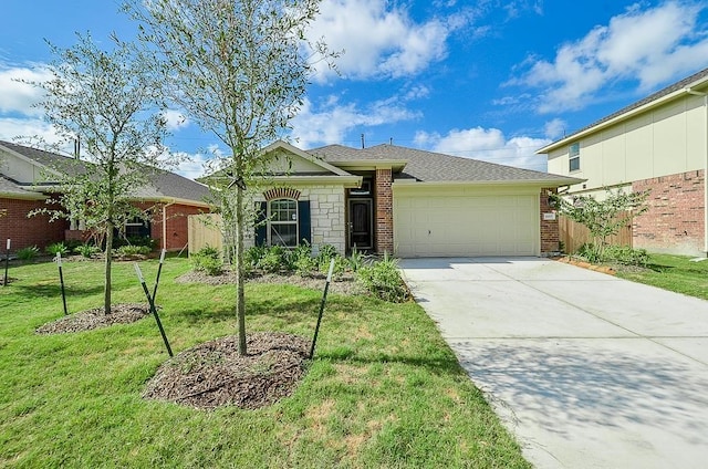 single story home featuring a front lawn and a garage