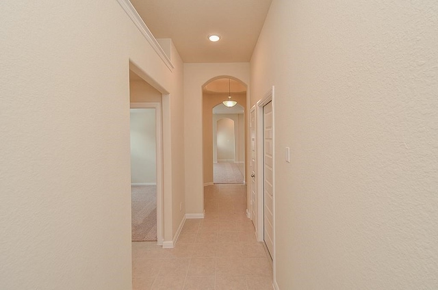 corridor with light tile patterned floors