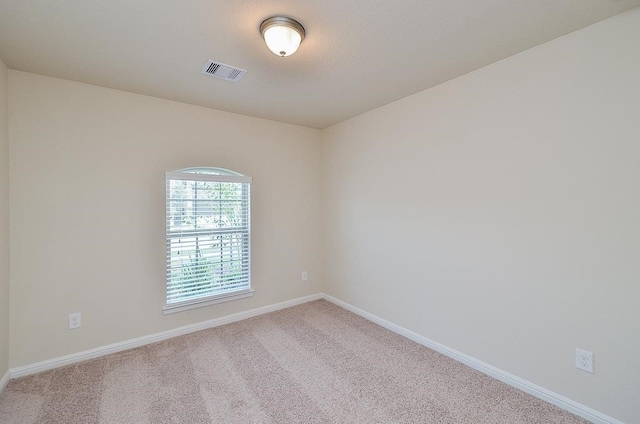 unfurnished room with carpet flooring