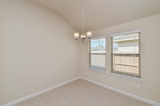 unfurnished room with light tile patterned floors, an inviting chandelier, and lofted ceiling