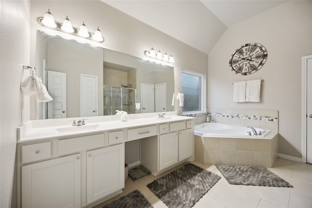 bathroom with vanity, lofted ceiling, separate shower and tub, and tile patterned flooring