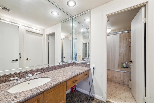 bathroom featuring vanity and walk in shower