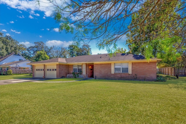 ranch-style house with a front yard and a garage