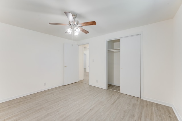 unfurnished bedroom with a closet, ceiling fan, and light wood-type flooring