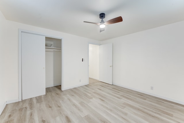 unfurnished bedroom featuring a closet, ceiling fan, and light wood-type flooring