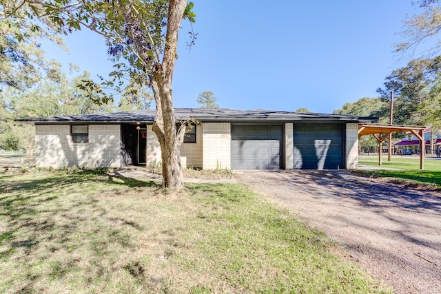 ranch-style house featuring a front lawn and a garage