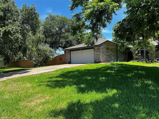 exterior space featuring a front yard and a garage