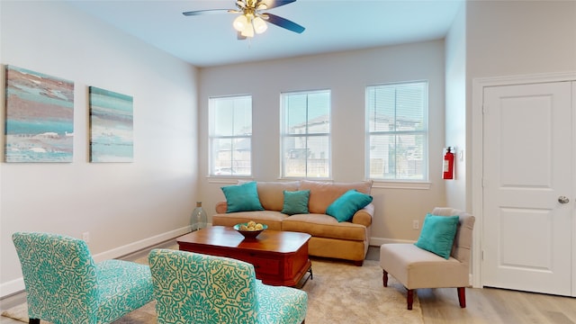 sitting room featuring light hardwood / wood-style floors and ceiling fan