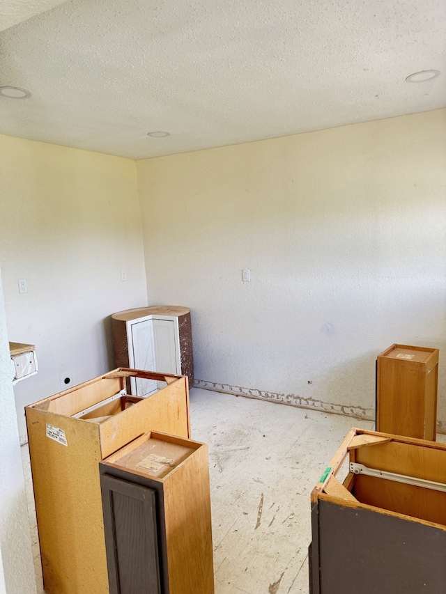 misc room featuring a textured ceiling