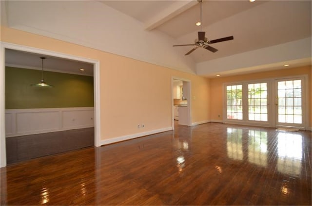 spare room featuring ceiling fan, lofted ceiling, and dark hardwood / wood-style flooring