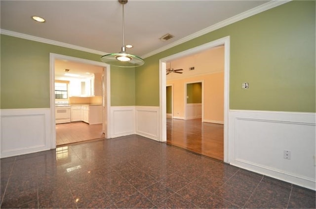 empty room with crown molding and dark hardwood / wood-style floors