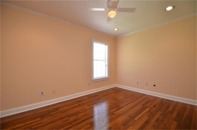 spare room featuring ornamental molding, dark hardwood / wood-style floors, and ceiling fan