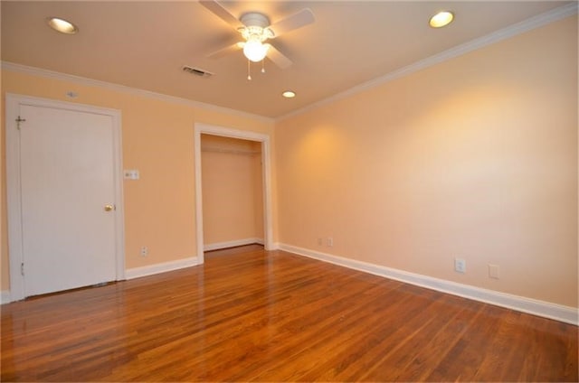 unfurnished room with ornamental molding, wood-type flooring, and ceiling fan