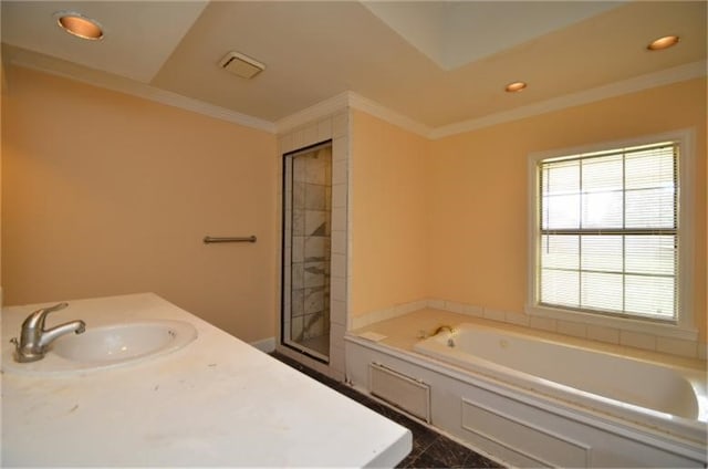 bathroom featuring independent shower and bath, crown molding, and sink